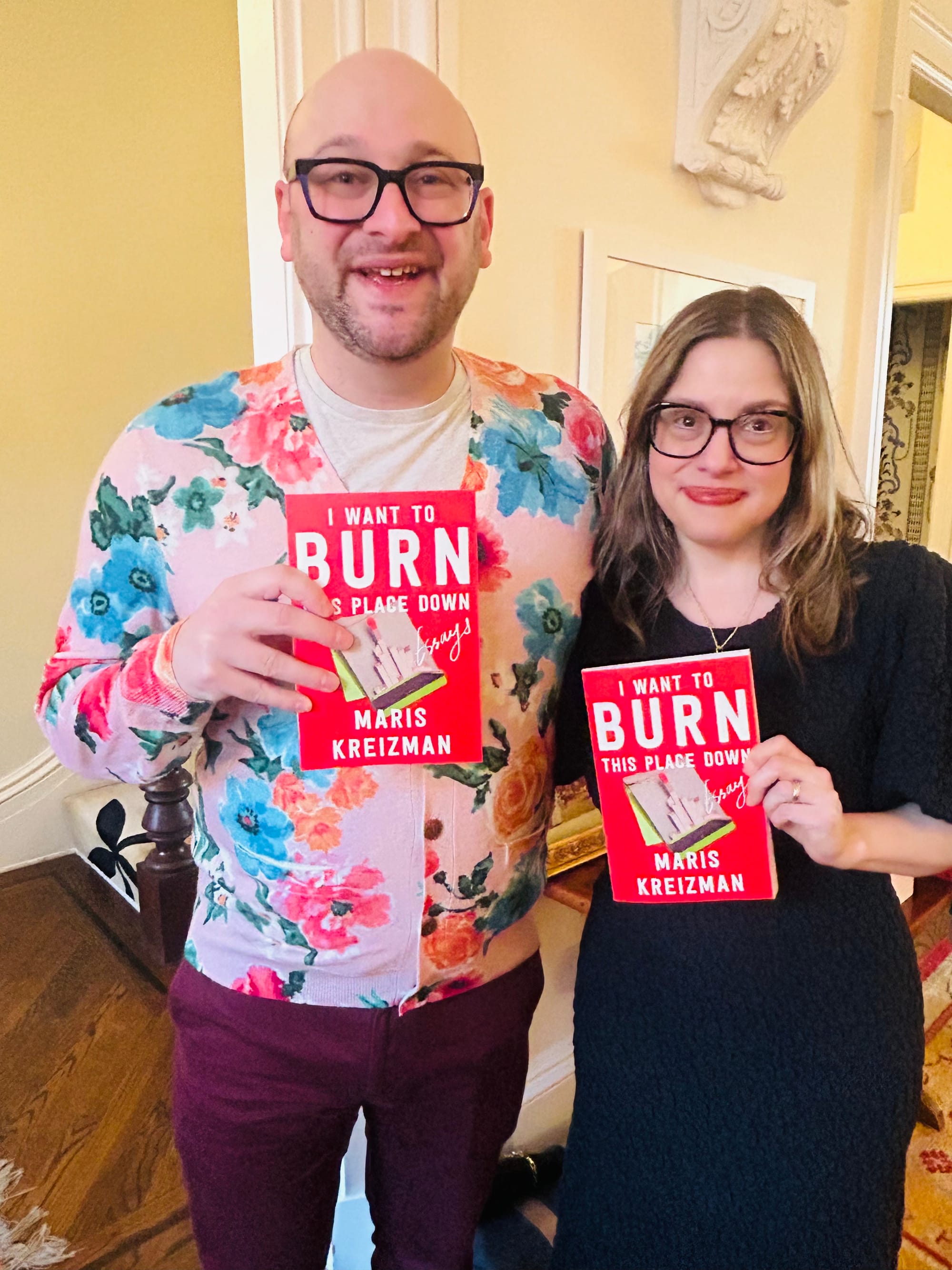 Me and Maris dressed up and holding copies of her essay collection.